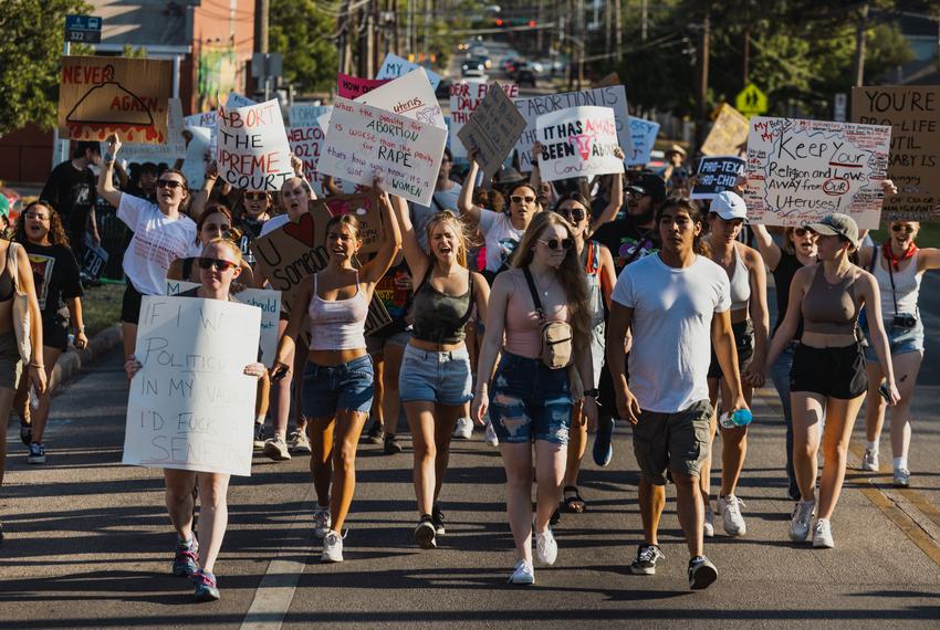 Abortion rights activists march through East Austin following a rally in East Austin on Jun. 26, 2022.